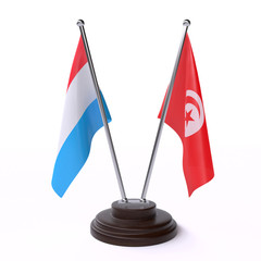 Luxembourg and Tunisia, two table flags isolated on white background. 3d image