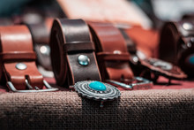 Details And Close Up Shot Of Real American Western Clothing. Leather Belts And Silver Buckles, Rodeo Lifestyle, Southern Patriotic Symbols. Cowboy Concept. 