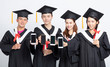 © Tom Wang - Group of graduate students showing smart phone