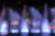 © Voranut - Defocused Blurred Abstract background of fountain light with colorful illuminations bokeh at night. Background Concept.