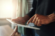 © StratfordProductions - Close-up of a man touching on digital tablet
