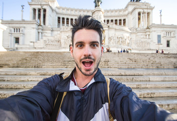 Wall Mural - Shocked tourist caucasian man taking a selfie on vacation in Rome, Italy