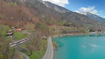 Wall Mural - Brienz town on lake Brienz by Interlaken with the Swiss Alps covered by snow in the background, Switzerland, Europe