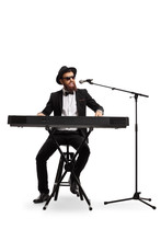 Male Musician Playing A Digital Piano And Singing On A Microphone Isolated On White Background