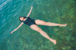© phpetrunina14 - young woman swimming in blue azure water
