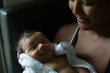 © Diane Durongpisitkul/Stocksy - A Mother Soothes Newborn Baby