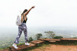 © Laura Austin/Stocksy - Woman Walking On Ruins On A Hike Adventure
