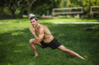 © Rachel Bellinsky/Stocksy - A fit man exercises in the park