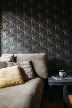 Retro Black And Gold Wallpaper With Sofa And Coffee Table