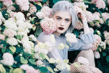 Portrait Of A Beautiful Young Woman In Flowers