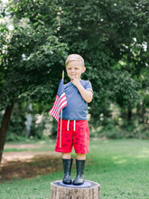 Little Boy Holding American Flag