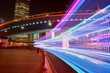 © Wenhai Tang/Stocksy - The highway car rainbow light trails of modern city buildings