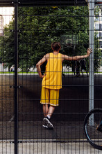 Basketball Player Leaning On Pipe