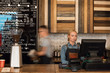 © Milles Studio/Stocksy - Girl and man working in cafeteria
