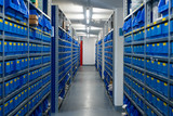 Fototapeta Miasto - Small Replacement Parts Storage Warehouse Racks Blue Boxes