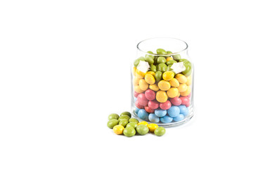 Wall Mural - Colorful sweet candies in glass jar isolated on white.