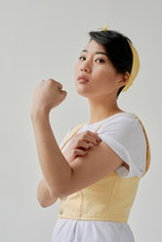 Young Woman Showing Strength