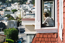 Young Woman In San Francisco Bay Window