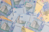Fototapeta  - Ukrainian money. Hryvnia paper bill. Small paper notes. Cash. Background texture.