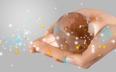 Sticker - Female hands holding glass Globe on background