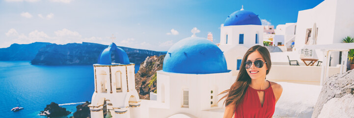 Fototapete - Europe summer vacation tourist woman walking in Oia city at three blue domes church, Santorini, Greece. Popular european attraction famous cruise travel. Banner panorama.