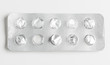 Silver blister packs pills isolated on white