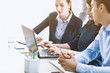 © StockPhotoPro - Professional business team working together at desk