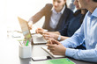© StockPhotoPro - Professional business team working together at desk
