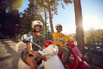 Wall Mural - Woman and man traveling on motorcycle and having fun..