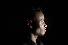 Portrait Of A African Man On Black Background,profile
