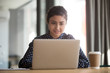 © fizkes - Focused indian female employee busy working at laptop in office