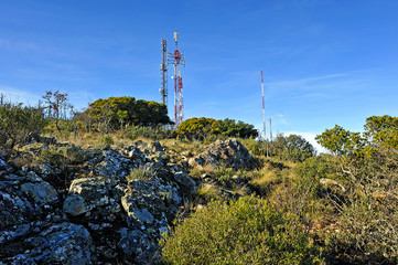 Telecommunication and telephony antennas in mountain pass of Puerto de Niefla. Valley of Alcudia and Sierra Madrona Natural Park, province of Ciudad Real, Spain.