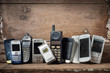© reshoot - Old and obsolete mobile phone or cell phones on space of old wood background
