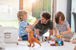 © pikselstock - Father playing with his children at home