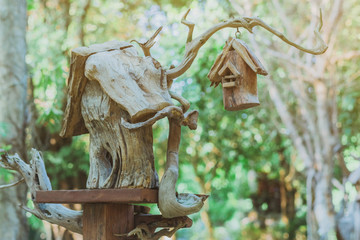 Hand made wooden bird house nest  in public Park , hand wood shelter for birds .