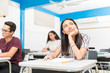 © AntonioDiaz - Cute Latin high school student daydreaming in class