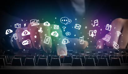 Blogger woman typing on keyboard with drawn application icons around
