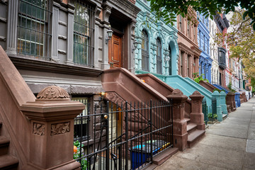 a view of a row of historic brownstones in an iconic neighborhood of Manhattan, New York City