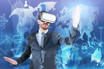 Canvas Print - Man in VR glasses working with world map