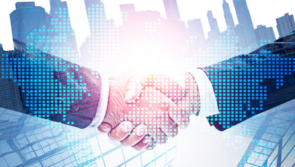 Handshake in city, international partnership