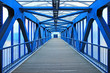 © Inna - The prospect of a long corridor of a pedestrian bridge made of bright blue iron construction