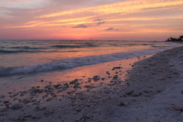 Beach sunset sky with pink pastel colors and clouds 