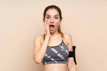 Young sport woman over isolated background with surprise and shocked facial expression