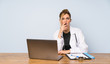© luismolinero - Blonde doctor woman surprised and shocked while looking right