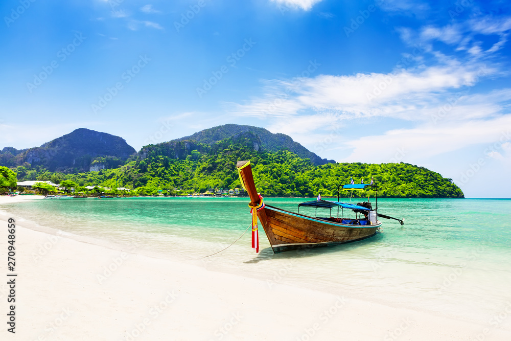 Thai traditional wooden longtail boat and beautiful sand beach. - obrazy, fototapety, plakaty 