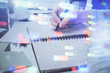 © peshkova - Double exposure of writing hand on background with data solution technology hologram. Ai concept.
