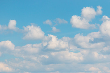 white clouds on blue background