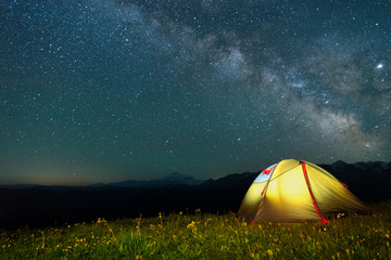 Poster - tourist tent of yellow color against the night sky with the Milky Way