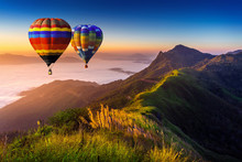 Landscape Of Morning Fog And Mountains With Hot Air Balloons At Sunrise.