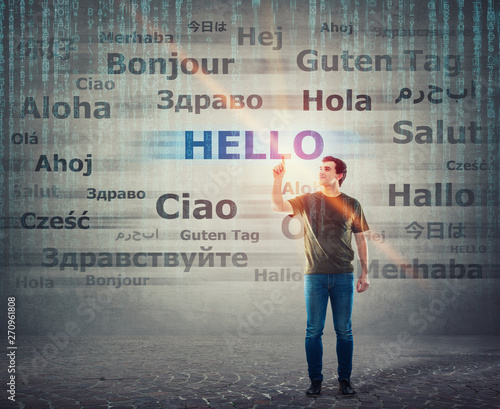 Foto Student guy pointing index finger up choosing word hello with different translations